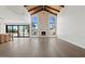 Spacious living room with vaulted wood ceilings and a stone fireplace at 10755 E Cholla Ln, Scottsdale, AZ 85259