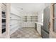 Walk-in pantry with open shelving and cabinetry at 10755 E Cholla Ln, Scottsdale, AZ 85259