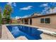Enjoy outdoor living with this pool and grassy area; perfect for relaxation and recreation at 1121 W Mission Dr, Chandler, AZ 85224