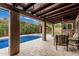 Inviting covered patio overlooking a sparkling blue pool, perfect for outdoor entertaining and relaxation at 1121 W Mission Dr, Chandler, AZ 85224
