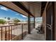 Relaxing covered balcony with seating, offering a private outdoor retreat with views of the neighborhood at 1121 W Mission Dr, Chandler, AZ 85224