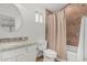 Cozy bathroom featuring granite vanity top and shower-tub combination, offering comfort and functionality at 1121 W Mission Dr, Chandler, AZ 85224
