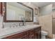 Elegant bathroom featuring double sinks, granite countertop, and a neutral color scheme at 1121 W Mission Dr, Chandler, AZ 85224
