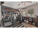 Cozy bedroom with loft bed, study area, and large bird cage at 1121 W Mission Dr, Chandler, AZ 85224