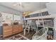 Charming bedroom featuring a loft bed, desk, and stylish decor at 1121 W Mission Dr, Chandler, AZ 85224