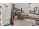 Bedroom featuring a daybed, home gym equipment, and an adjacent bedroom at 1121 W Mission Dr, Chandler, AZ 85224
