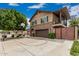 Charming two-story home featuring a stone facade, balcony, basketball court and well-maintained landscaping at 1121 W Mission Dr, Chandler, AZ 85224