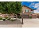 Charming two-story home featuring a stone facade, landscaped yard and inviting front entrance at 1121 W Mission Dr, Chandler, AZ 85224