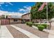 Well-maintained two-story home with stone accents, solar panels, landscaped front yard and long driveway at 1121 W Mission Dr, Chandler, AZ 85224
