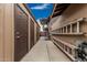 Exterior alleyway and staircase shows an entry to possible extra storage and second story deck at 1121 W Mission Dr, Chandler, AZ 85224