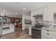 Modern kitchen showcasing stainless steel appliances, sleek countertops, and an open design at 1121 W Mission Dr, Chandler, AZ 85224