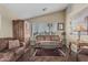 Comfortable living room with plush seating, a glass-top table, and stylish decor at 1121 W Mission Dr, Chandler, AZ 85224