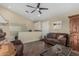 Cozy living room with comfortable seating, modern lighting, and well-maintained floors at 1121 W Mission Dr, Chandler, AZ 85224