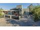 An expansive backyard with a covered patio, a gravel landscape, and block perimeter fencing at 1211 E Hayward Ave, Phoenix, AZ 85020