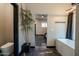 Hallway between bathroom and main bedroom with stand alone tub at 1211 E Hayward Ave, Phoenix, AZ 85020