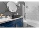 Modern bathroom with black sink, brass fixtures, and a luxurious soaking tub with white marble at 1211 E Hayward Ave, Phoenix, AZ 85020