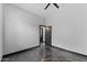 Bright bedroom featuring polished concrete floors, modern ceiling fan, and grey paint at 1211 E Hayward Ave, Phoenix, AZ 85020