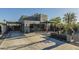 Contemporary home featuring a zero landscape front yard, covered patio, and driveway with a carport at 1211 E Hayward Ave, Phoenix, AZ 85020