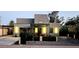 Modern home featuring stylish lighting, a covered patio, and a zero landscape front yard at 1211 E Hayward Ave, Phoenix, AZ 85020