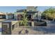 Modern home showcasing a covered patio, manicured landscaping, and zero landscape front yard at 1211 E Hayward Ave, Phoenix, AZ 85020