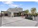 Striking modern home with a clean design, spacious driveway, and inviting outdoor entertaining area at 1211 E Hayward Ave, Phoenix, AZ 85020
