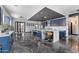 Modern kitchen with sleek blue cabinets, marble countertops, and a large island with seating at 1211 E Hayward Ave, Phoenix, AZ 85020