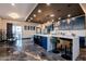 Modern kitchen featuring a large island with bar seating and sleek stainless steel appliances at 1211 E Hayward Ave, Phoenix, AZ 85020