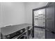 Laundry room with washer and dryer, plus door to closet with white shelves at 1211 E Hayward Ave, Phoenix, AZ 85020