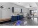 Stylish living room with modern finishes, a wet bar, and a dining area at 1211 E Hayward Ave, Phoenix, AZ 85020