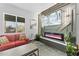 Bright living room with a decorative fireplace and large windows offering natural light at 1211 E Hayward Ave, Phoenix, AZ 85020