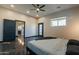 Spacious main bedroom with ceiling fan and view to en suite bathroom at 1211 E Hayward Ave, Phoenix, AZ 85020