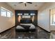 Main bedroom featuring accent wall, modern lighting and polished concrete floors at 1211 E Hayward Ave, Phoenix, AZ 85020