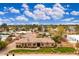 Elevated view of a beautiful home showcasing its well-manicured lawn, landscaping, and inviting curb appeal at 13206 N 64Th St, Scottsdale, AZ 85254