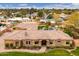 Stunning aerial view of a sprawling estate with a pool, lush landscaping, and a meticulously maintained front yard at 13206 N 64Th St, Scottsdale, AZ 85254