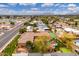 Expansive aerial view of a private estate featuring a tennis court, pool, and lush landscaping at 13206 N 64Th St, Scottsdale, AZ 85254