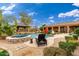 Stunning backyard retreat featuring a pool, spa, and outdoor dining area for entertainment at 13206 N 64Th St, Scottsdale, AZ 85254