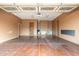 Garage featuring finished floor and walls and decorated ceiling at 13206 N 64Th St, Scottsdale, AZ 85254