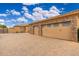 Spacious three car garage with brick paver driveway and desert landscaping provides ample parking at 13206 N 64Th St, Scottsdale, AZ 85254