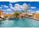 Stunning backyard pool with a rock waterfall, spa, and lush tropical landscaping at 13206 N 64Th St, Scottsdale, AZ 85254