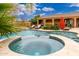 Backyard featuring a pool, hot tub, and patio area perfect for relaxation and entertaining at 13206 N 64Th St, Scottsdale, AZ 85254