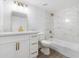 Remodeled bathroom featuring a white vanity with modern hardware, new fixtures, and a bathtub/shower combo at 13624 N 31St Ave, Phoenix, AZ 85029