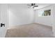 Bedroom with neutral-colored walls, bright windows, ceiling fan and plush carpeting at 13624 N 31St Ave, Phoenix, AZ 85029