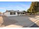 Inviting single-story home with a spacious driveway, manicured landscaping, and charming curb appeal at 13624 N 31St Ave, Phoenix, AZ 85029