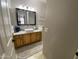 Bright bathroom featuring a stylish vanity with granite countertop and a modern sink at 14950 W Mountain View Blvd # 2210, Surprise, AZ 85374