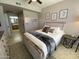Inviting bedroom with stylish decor, neutral colors, and an ensuite bathroom at 14950 W Mountain View Blvd # 2210, Surprise, AZ 85374