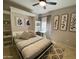 Cozy bedroom featuring a murphy bed with built-in shelving and stylish decor at 14950 W Mountain View Blvd # 2210, Surprise, AZ 85374