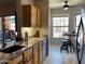 Modern kitchen features granite counters, undermount sink, stainless appliances and cozy breakfast nook at 14950 W Mountain View Blvd # 2210, Surprise, AZ 85374