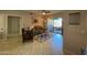 Cozy living room with a ceiling fan, tile floors, and a door to the balcony at 14950 W Mountain View Blvd # 2210, Surprise, AZ 85374