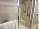 Modern shower with glass door and convenient grab bar at 14950 W Mountain View Blvd # 2210, Surprise, AZ 85374