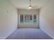 This bedroom features neutral carpet and a large window offering natural light and a view at 16 W Encanto Blvd # 305, Phoenix, AZ 85003